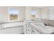 Bright bathroom featuring a soaking tub, double sinks, and ample natural light at 4055 10Th Avenue Sw Dr, Hickory, NC 28602