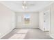 A cozy, bright bedroom with neutral carpet, ceiling fan, and window views at 4055 10Th Avenue Sw Dr, Hickory, NC 28602