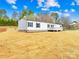 Attractive single-story home with a lovely porch and neatly landscaped yard on a bright day at 4055 10Th Avenue Sw Dr, Hickory, NC 28602