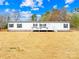 Charming single-story home featuring a front porch and well-maintained landscaping on a sunny day at 4055 10Th Avenue Sw Dr, Hickory, NC 28602