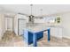 Well-equipped kitchen featuring a blue island, stainless steel appliances, and marble countertops at 4055 10Th Avenue Sw Dr, Hickory, NC 28602