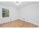 Well-lit bedroom with hardwood floors and large windows at 437 Chadmore Dr, Charlotte, NC 28270