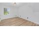 Cozy bedroom with hardwood floors and a bright window with natural light at 437 Chadmore Dr, Charlotte, NC 28270