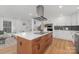 Spacious kitchen features an island, stainless steel appliances, and hardwood flooring at 437 Chadmore Dr, Charlotte, NC 28270