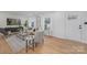 Well-lit living room with a sofa, chairs, and a view of the entrance at 437 Chadmore Dr, Charlotte, NC 28270