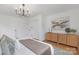 Bright bedroom featuring modern décor, ample storage, and a chandelier at 437 Chadmore Dr, Charlotte, NC 28270