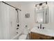 Modern bathroom with subway tile shower, dark hardware, and a stylish vanity and mirror at 464 Hurston Cir, Charlotte, NC 28208