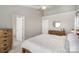 Comfortable bedroom featuring neutral walls, ceiling fan, and natural wood accents at 464 Hurston Cir, Charlotte, NC 28208