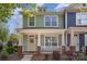 Charming two-story home with a welcoming front porch, white pillars, and a well-maintained lawn at 464 Hurston Cir, Charlotte, NC 28208