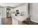 Contemporary kitchen with granite island, stainless steel appliances, white cabinets, and bar stool seating at 464 Hurston Cir, Charlotte, NC 28208
