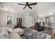 Open-concept living room with hardwood floors, neutral walls, and views into the kitchen at 464 Hurston Cir, Charlotte, NC 28208