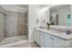 Bathroom featuring a double vanity with granite countertop and a glass enclosed walk-in shower at 5140 Oak Grove Pl, Waxhaw, NC 28173