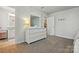 Bedroom featuring carpet, a dresser, and a peek into an attached bathroom at 5140 Oak Grove Pl, Waxhaw, NC 28173