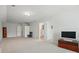 Spacious bonus room with neutral carpet and multiple doors, creating flexible space at 5140 Oak Grove Pl, Waxhaw, NC 28173