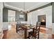 Dining room showcasing modern chandelier, decorative trim, and an inviting dining table at 5140 Oak Grove Pl, Waxhaw, NC 28173
