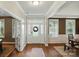Inviting home entryway featuring wood floors, a decorative wreath, and bright natural light at 5140 Oak Grove Pl, Waxhaw, NC 28173