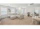 Bright living room with a sectional sofa, neutral carpet, and a play area at 5140 Oak Grove Pl, Waxhaw, NC 28173