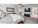 Beautiful main bedroom featuring a large bed and access to an ensuite bath at 5140 Oak Grove Pl, Waxhaw, NC 28173