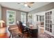 Bright office with a large desk, plenty of natural light, and an open doorway at 5140 Oak Grove Pl, Waxhaw, NC 28173