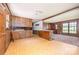 Inviting living area with wood paneling, a stone accent and an adjacent carpeted seating area at 5275 Long Ferry Rd, Salisbury, NC 28146