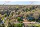 An aerial view of a traditional two-story home on a .49 acre lot just 5 miles outside of Uptown Charlotte at 5309 Silchester Ln, Charlotte, NC 28215