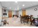 Finished basement space with a dining table and foosball table, perfect for entertainment and activities at 5309 Silchester Ln, Charlotte, NC 28215