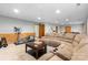 Relaxing basement offering a comfortable sitting area, and gym equipment at 5309 Silchester Ln, Charlotte, NC 28215