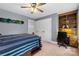 Bedroom with snowboard on wall, built-in bookshelves and desk, large closet space at 5309 Silchester Ln, Charlotte, NC 28215