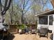 Beautiful wooden deck featuring patio furniture and grill, perfect for outdoor entertaining at 5309 Silchester Ln, Charlotte, NC 28215