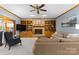 Inviting living room with a brick fireplace, built-in shelves, and comfortable seating at 5309 Silchester Ln, Charlotte, NC 28215