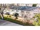 An aerial view captures the townhomes with lush green landscaping and a sense of community at 5909 Quail Hollow Rd # B, Charlotte, NC 28210
