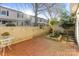 A fully fenced backyard with brick-paved patio offers a private outdoor retreat at 5909 Quail Hollow Rd # B, Charlotte, NC 28210