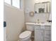 This renovated half bath features white fixtures, stylish hardware, and modern wall decor at 5909 Quail Hollow Rd # B, Charlotte, NC 28210