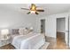 This light and airy bedroom has hardwood floors, a ceiling fan, and an attached bathroom for convenience at 5909 Quail Hollow Rd # B, Charlotte, NC 28210
