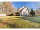 Expansive backyard with lush green lawn and mature trees offering plenty of shade and privacy at 617 Edinburgh Ct, Rock Hill, SC 29730