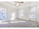 Bright bedroom with many windows and a ceiling fan at 617 Edinburgh Ct, Rock Hill, SC 29730