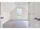 Bedroom with a unique window, neutral carpeting, and ample natural light at 617 Edinburgh Ct, Rock Hill, SC 29730