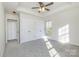 Bedroom featuring a ceiling fan, large closet, and well-lit windows at 617 Edinburgh Ct, Rock Hill, SC 29730