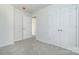 Bedroom with neutral walls and carpet, a double door closet, and an ensuite bathroom at 617 Edinburgh Ct, Rock Hill, SC 29730
