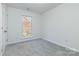 Cozy bedroom featuring a window with natural light and neutral carpeting at 617 Edinburgh Ct, Rock Hill, SC 29730