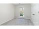 Bedroom featuring a window with a view, neutral carpeting, and ample natural light at 617 Edinburgh Ct, Rock Hill, SC 29730