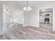 Open dining space with decorative chandelier and view into the kitchen with stainless appliances at 617 Edinburgh Ct, Rock Hill, SC 29730