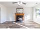 Bright living room with fireplace and large mirror in neutrally decorated home at 617 Edinburgh Ct, Rock Hill, SC 29730