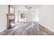 Sunlit living room with fireplace, new flooring, and freshly painted walls in neutral color at 617 Edinburgh Ct, Rock Hill, SC 29730