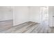 Empty room featuring a gray plank floor and chandelier in a well lit home at 617 Edinburgh Ct, Rock Hill, SC 29730