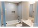 The updated bathroom features stylish subway tile, a shower and modern fixtures at 634 Mckee St, Albemarle, NC 28001