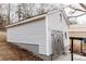 Exterior of the detached garage showing siding, doors, and access to a lower level at 634 Mckee St, Albemarle, NC 28001