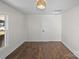 Well-lit bedroom with hardwood floors, a modern light fixture, and a closet for storage at 691 Gibson Nw Dr, Concord, NC 28025