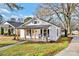 Charming renovated home with a welcoming porch, black shutters, and updated landscaping at 691 Gibson Nw Dr, Concord, NC 28025