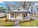 Inviting front porch with stylish seating, perfect for relaxing and enjoying the outdoors at 691 Gibson Nw Dr, Concord, NC 28025